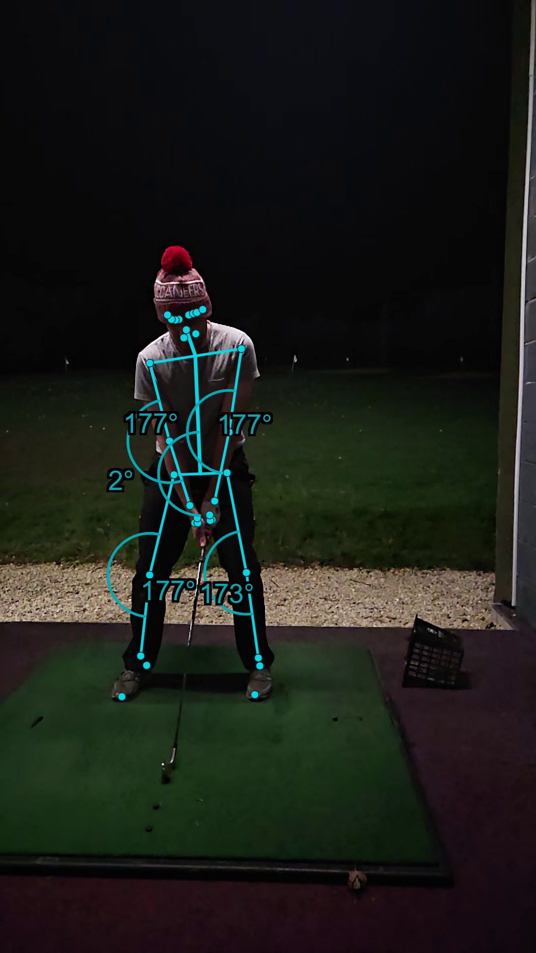 Golf swing setup position with AI pose overlay showing spine tilt and knee flex angles